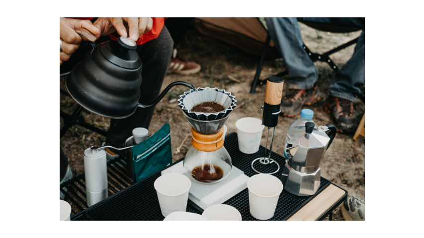 a person making pour over coffee