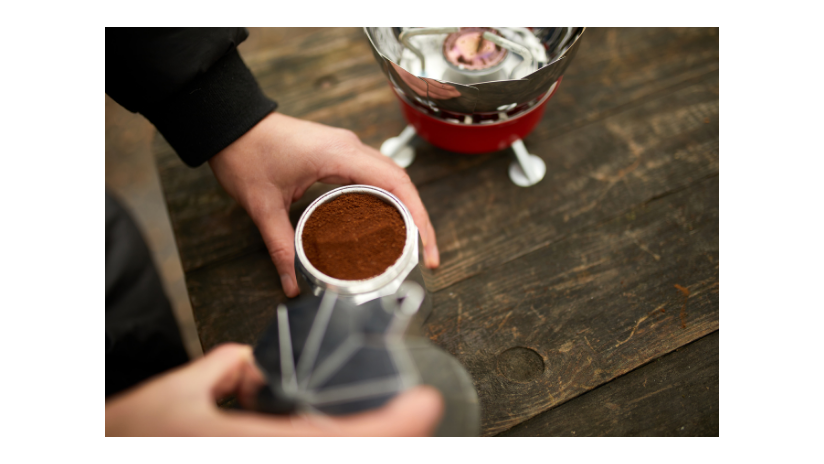 Man holding pot of instant coffee