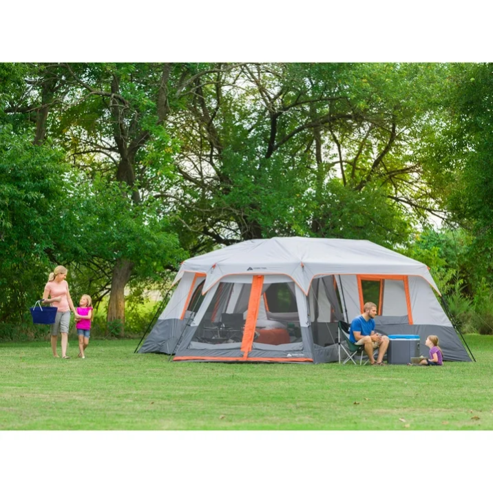 People sitting on a chair next to a tent