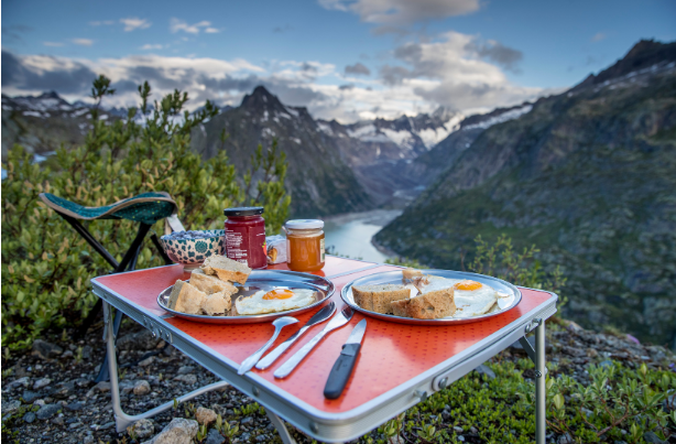 Breakfast on a table with a view of the mountains