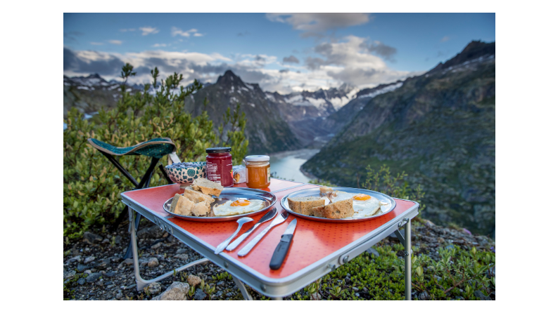 Breakfast on a table with a view of the mountains