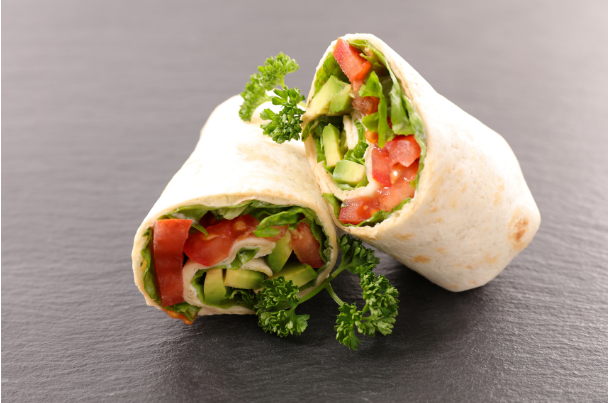 a vegetable wrap burrito on a table