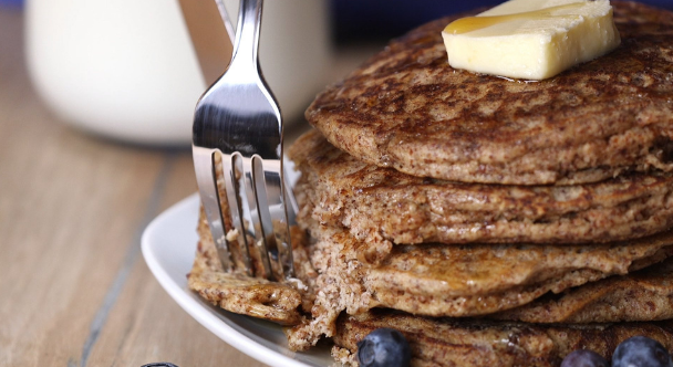 Buckwheat pancakes on a plate with a fork